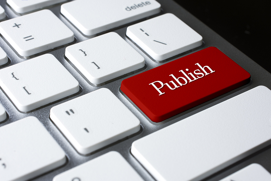 Publish on Red Enter Button on white keyboard