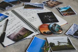 Assorted-photos and Notebook on the floor
