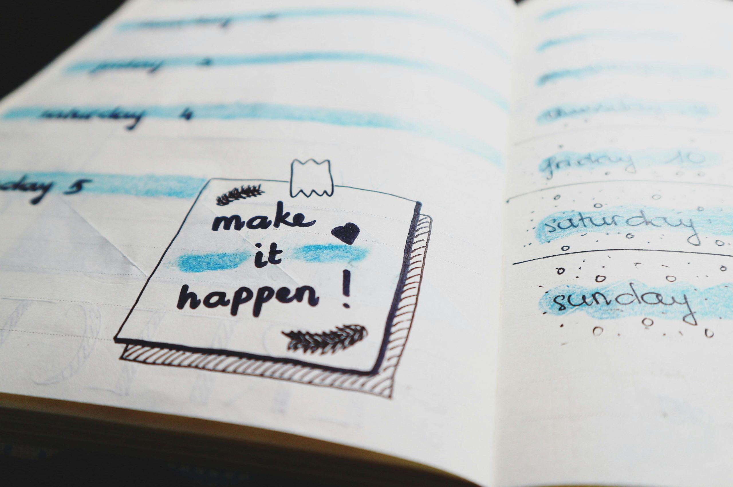 calendar with 'make it happen' written on a day ent;ry